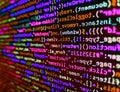 Lots of digits on the computer screen. Abstract computer script  code. Developer working on source codes on computer at office. Royalty Free Stock Photo