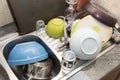 Lots of dirty dishes in the sink Royalty Free Stock Photo