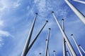 Lots of empty flagpoles against a blue sky Royalty Free Stock Photo