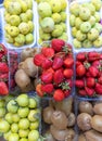 Lots of fresh berries and fruits on the counter at the farmers market. Royalty Free Stock Photo