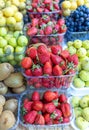 Lots of fresh berries and fruits on the counter at the farmers market. Royalty Free Stock Photo