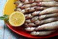 Lots of fresh smelt fish on white plate, Gutted fish Royalty Free Stock Photo