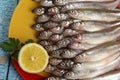 Lots of fresh smelt fish on white plate, Gutted fish Royalty Free Stock Photo