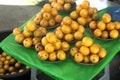 lots of fresh yellow gandaria fruit on the table