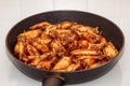 Lots of fried chicken wings in a pan on a white ceramic plate. home cooking Royalty Free Stock Photo