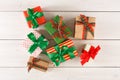 Handmade modern presents in colored paper decorated with red, green satin ribbon bows Royalty Free Stock Photo