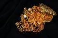 Lots of golden jewelry over a black background Royalty Free Stock Photo