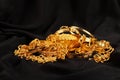 Lots of golden luxury jewels over a black background Royalty Free Stock Photo