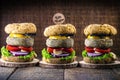 Lots of gourmet vegan snacks, meatless hamburgers, with small sign written in English Vegan life. Gluten-free meal, made with