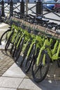 Lots of green bikes `smart bike` with baskets for rent