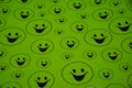 Lots of green smiling big and small smileys