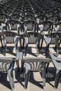 Lots of grey plastic chairs in the row Royalty Free Stock Photo