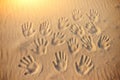 Lots of hand prints on the sand Royalty Free Stock Photo