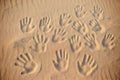 Lots of hand prints on the sand Royalty Free Stock Photo