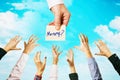 Lots of hands amid sky with clouds. People are drawn to the opportunity to get money. Concept on the topic of earnings Royalty Free Stock Photo