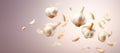 Lots of heads of garlic. Flying garlic on a light background