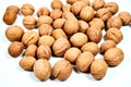Lots of inshell Walnuts on white background Royalty Free Stock Photo