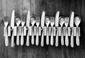 Lots of knives forks and spoon in cutlery holders