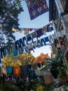 Lots of laundry hanging in the yard. Drying clothes outdoors Royalty Free Stock Photo