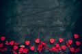 Lots of little red hearts on black background. romantic love background for Valentine`s day, birthday, party, wedding.