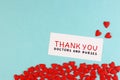 Lots of little red hearts and the inscription Thank you to doctors and nurses on a blue background