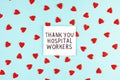 Lots of little red hearts and the inscription Thank you to hospital workers on a blue background