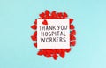 Lots of little red hearts and the inscription Thank you to hospital workers on a blue background