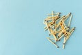 Lots of matches on a blue background. The concept of chaos and order. Selective focus