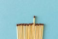 Lots of matches on a blue background. The concept of chaos and order. Selective focus