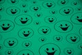 Lots of mint green smiling big and small smileys