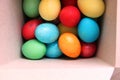 Lots of multi-colored Easter eggs in a white square box. Easter preparations. Painting eggs. painted eggs, tinting