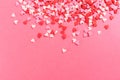 Lots of multicolored hearts on pink background for Valentine`s day