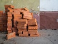Lots of old bricks piled up. Wall of different colors. Construction atmosphere Royalty Free Stock Photo