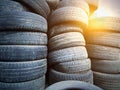 Lots of old worn rubber tires for car wheels at a service station