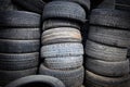 Lots of old worn rubber tires for car wheels at a service station