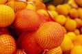 Lots of oranges on the counter in the store. Vitamins and healthy food. Close-up Royalty Free Stock Photo