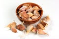 Lots of organically grown garlic cloves on a white background