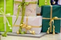 Lots packaged boxes with gifts in green, beige and gold color. big stack of Christmas presents. christmas holidays decor Royalty Free Stock Photo