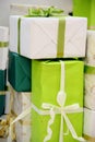 lots Packed boxes with gifts in green, beige and gold colors. large stack of Christmas gifts Royalty Free Stock Photo