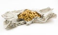 Lots of peanuts in a paper wrap on white background Royalty Free Stock Photo