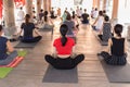 People practicing yoga at a commuinity place