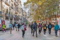 Lots of people walking along Portal de l`Angel street in Barcelona