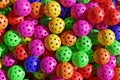 Lots of Pickleball multicolored sports balls.