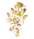 Lots of pistachios crushed in the air on white background