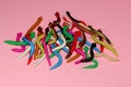 lots of plasticine snakes colorfull pink backgraund
