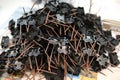 Lots of radios. Loose electronic parts on the table. Digital indicator, LEDs, capacitor and microcircuits in a pile. Electrical