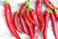 Lots of red fresh chili peppers on the concrete floor Royalty Free Stock Photo