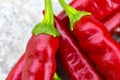 Lots of red fresh chili peppers on the concrete floor Royalty Free Stock Photo