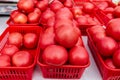 Lots of red tomatoes in plastic trays on the counter. Sale of tomatoes at the farmers\' market. Red ripe tomatoes. Close-up Royalty Free Stock Photo