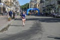 Lots of runners with sportswear and running shoes during the marathon Royalty Free Stock Photo